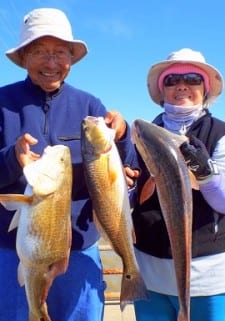 Lee and Mee Ghing of Houston caught these nice slot reds on shrimp