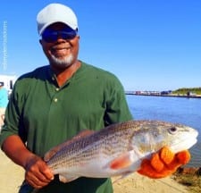 Mo City angler Phil Lurell hfts this nice 28inch slot red caught on shrimp