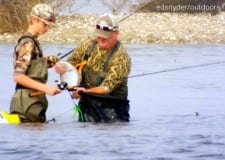 Son and Dad wade fishing team working Rollover Bay for flounder