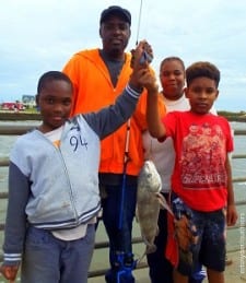 The Bowie Family of Houston had fun today catching fish at Rollover Pass