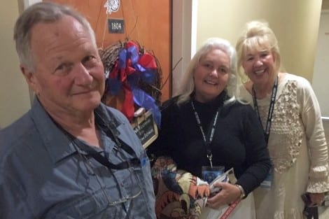 Melanie welcomes Marcel and Linda to Ft. Worth with her Cow Town decorated door