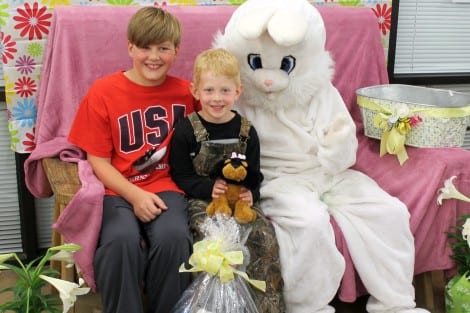 Preston Marlar, age 5, grinned with pleasure when he received his Easter Dog and huge Easter basket. (Big Brother Landon helped him balance that big basket.)