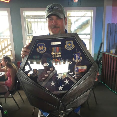 Darren displays his special service commemorative box.