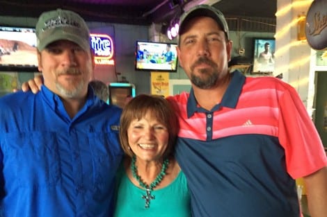 Proud mom Margo Johnson with Tech Sergeants Darren and J. Dean Moody at Darren's retirement party.