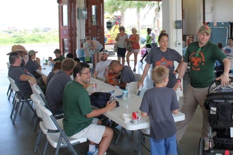 Volunteers relaxing and enjoying lunch at the CB Fire Station after the clean-up