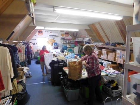 Second Going volunteers work busy hours sorting through boxes and bags to find quality items that have much more life left in them.