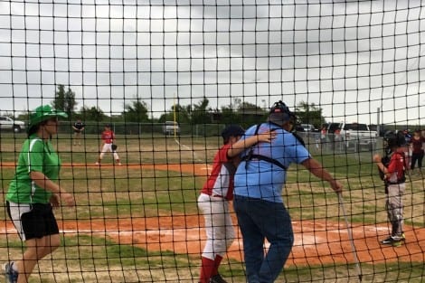 AJ Lowe escorted visually impaired Umpire Craig to home plate 