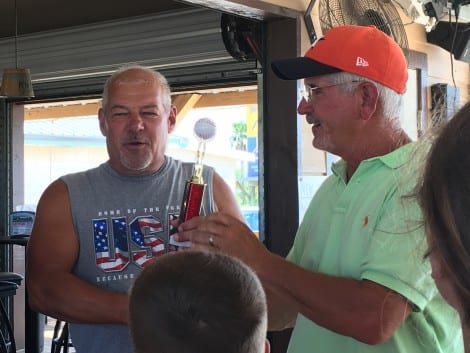 Jim Sutjak, owner of The Gulf Range, presented with sponsor trophy