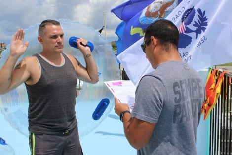 USCG LTJG Mark Velez reading the oath