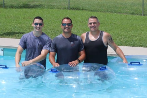 Oscar, Mark, and Corey after a ride down the chute